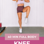 40-Minute Knee Friendly Fat Loss Workout for Women Over 40 3 Garage Fitness Girl Woman over 40 holding a dumbbell overhead during a knee lift in a knee friendly full body workout