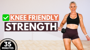 Woman doing a knee friendly strength workout standing with dumbbells