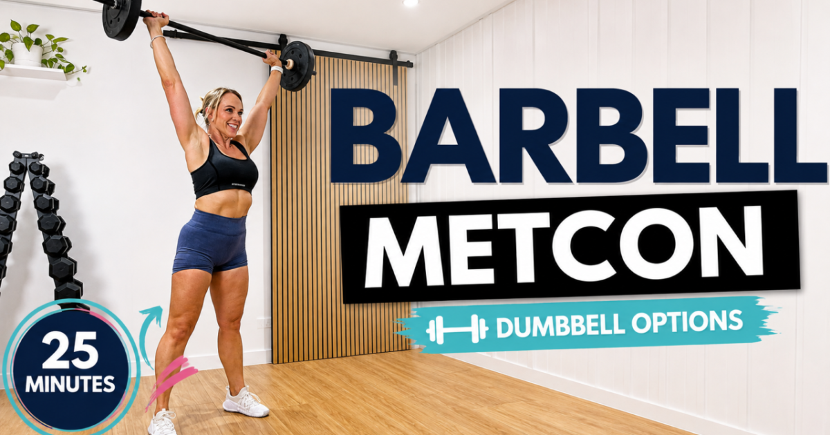 Penny pressing a barbell overhead in her garage gym for a 25 minute barbell Tabata metabolic workout with dumbbell options
