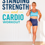 Woman in a light blue sports bra and navy shorts performing a standing high-knee cardio move during a 35-minute standing strength and cardio workout for Garage Fitness Girl.