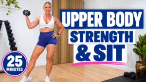 Woman over 40 holding a dumbbell for a 25 minute upper body strength workout with a SIT finisher